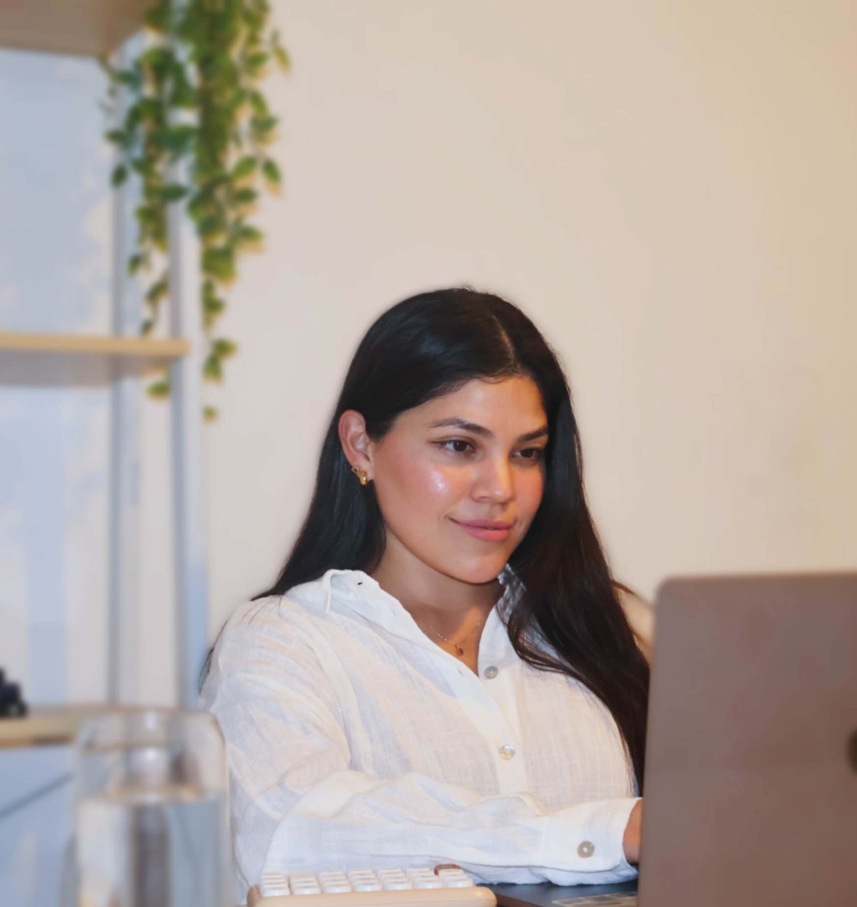 Karo on a laptop checking out her digital products