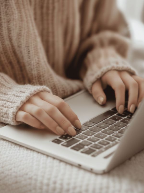 on laptop on bookkeeping spreadsheet