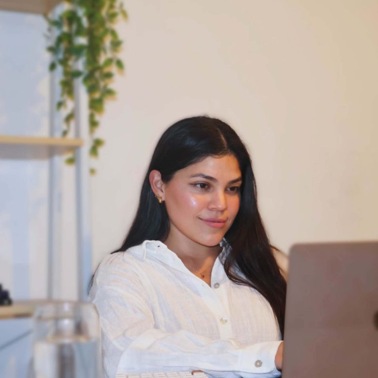 Karo on a laptop checking out her digital products